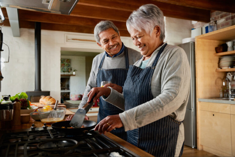 Older couple cooking in the kitchen together