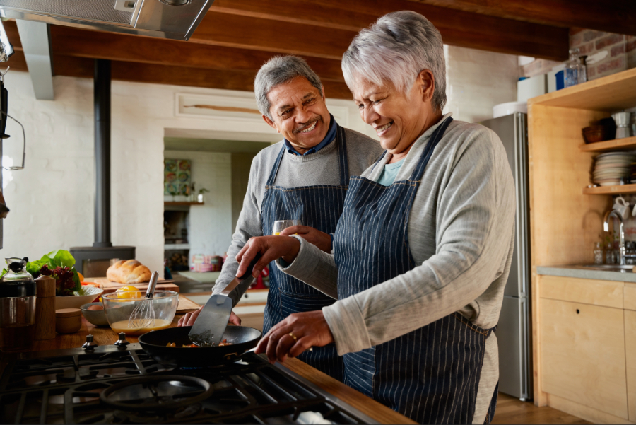 Older couple cooking in the kitchen together